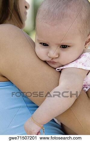 Close-up of a mother with her daughter View Large Photo Image Stock Image - Close-up of a mother with her daughter. Fotosearch