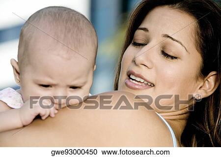 Close-up of a mother with her daughter View Large Photo Image Stock Image - Close-up of a mother with her daughter. Fotosearch