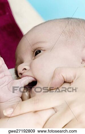 Close-up of a mother with her daughter View Large Photo Image Stock Photo - Close-up of a mother with her daughter. Fotosearch