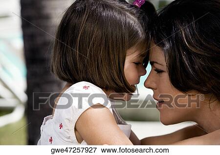 Close-up of a mother with her daughter View Large Photo Image Stock Photo - Close-up of a mother with her daughter. Fotosearch