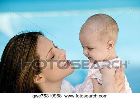 Close-up of a mother with her daughter View Large Photo Image Stock Photo - Close-up of a mother with her daughter. Fotosearch
