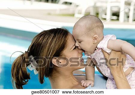 Close-up of a mother with her daughter playing View Large Photo Image Stock Photo - Close-up of a mother with her daughter playing. Fotosearch