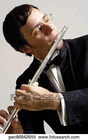 Close-up of a musician playing the flute View Large Photo Image Stock Photography - Close-up of a musician playing the flute. Fotosearch