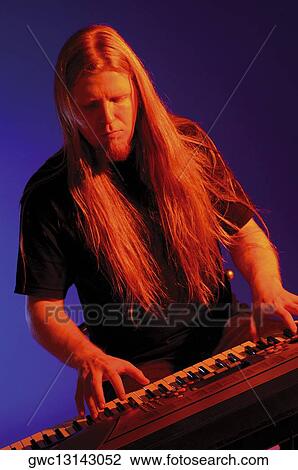 Close-up of a musician playing the synthesizer View Large Photo Image Stock Image - Close-up of a musician playing the synthesizer. Fotosearch