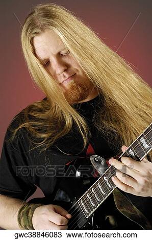 Close-up of a musician playing the electric guitar View Large Photo Image Stock Image - Close-up of a musician playing the electric guitar. Fotosearch