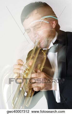 Close-up of a musician playing the trumpet View Large Photo Image Stock Image - Close-up of a musician playing the trumpet. Fotosearch