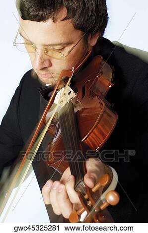 Close-up of a musician playing the violin View Large Photo Image Stock Image - Close-up of a musician playing the violin. Fotosearch