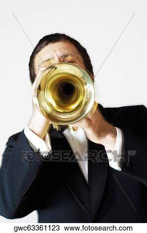 Close-up of a musician playing the trumpet View Large Photo Image Stock Image - Close-up of a musician playing the trumpet. Fotosearch