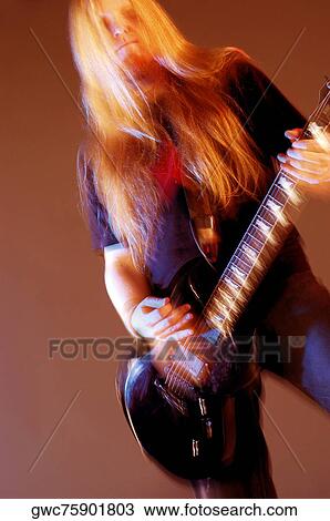 Close-up of a musician playing the electric guitar View Large Photo Image Stock Image - Close-up of a musician playing the electric guitar. Fotosearch