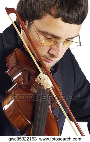Stock Image - Close-up of a musician playing the violin. Fotosearch