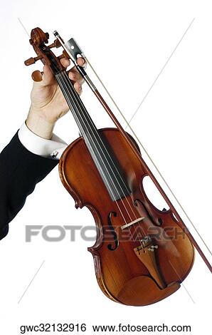Close-up of a musician's hand holding a violin View Large Photo Image Stock Photograph - Close-up of a musician's hand holding a violin. Fotosearch