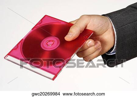 Picture - Close-up of a person's hand holding a compact disk. Fotosearch