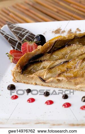Close-up of a pie in a plate View Large Photo Image Stock Image - Close-up of a pie in a plate. Fotosearch