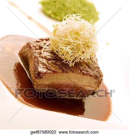 Close-up of a piece of grilled meat served on a tray View Large Photo Image Stock Image - Close-up of a piece of grilled meat served on a tray. Fotosearch