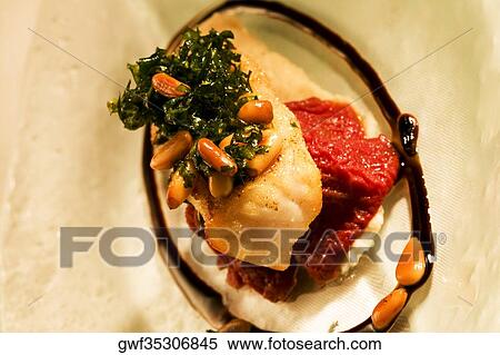 Stock Photography - Close-up of a portion of a gourmet dish. Fotosearch