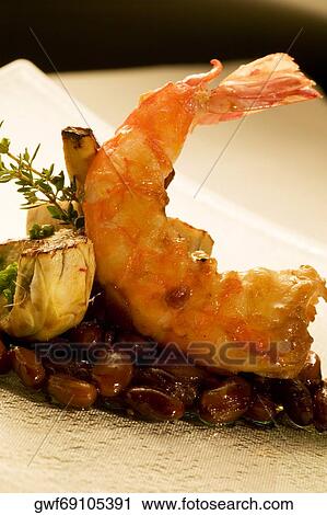 Close-up of a prawn served on beans View Large Photo Image Stock Image - Close-up of a prawn served on beans. Fotosearch