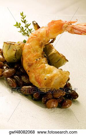 Close-up of a prawn served on beans View Large Photo Image Stock Photo - Close-up of a prawn served on beans. Fotosearch