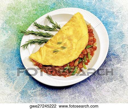 Close-up of a stuffed omelet in a plate View Large Photo Image Stock Image - Close-up of a stuffed omelet in a plate. Fotosearch
