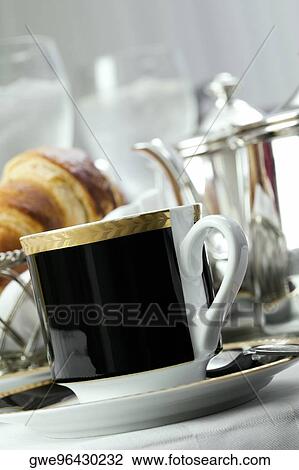 Close-up of a tea cup in a saucer View Large Photo Image Stock Image - Close-up of a tea cup in a saucer. Fotosearch