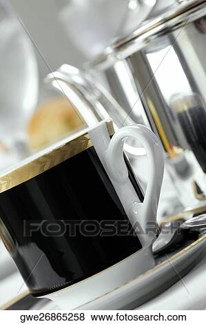 Close-up of a tea cup in a saucer View Large Photo Image Stock Photo - Close-up of a tea cup in a saucer. Fotosearch