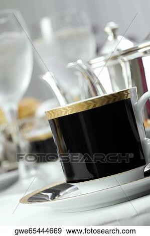 Close-up of a tea cup in a saucer View Large Photo Image Stock Photo - Close-up of a tea cup in a saucer. Fotosearch