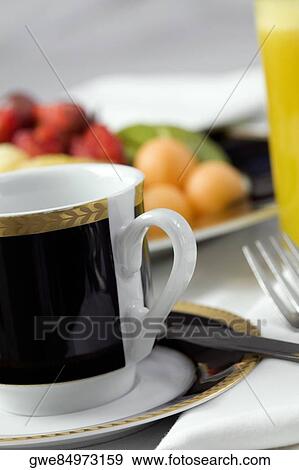 Close-up of a tea cup in a saucer View Large Photo Image Stock Photo - Close-up of a tea cup in a saucer. Fotosearch