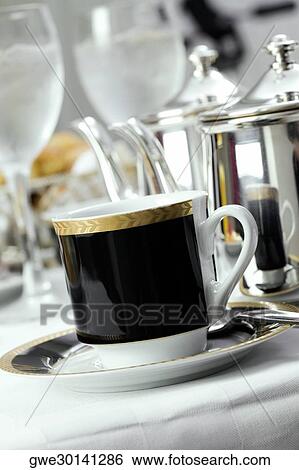 Close-up of a tea cup in a saucer View Large Photo Image Stock Photograph - Close-up of a tea cup in a saucer. Fotosearch