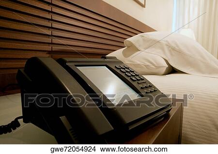 Close-up of a telephone on a night table View Large Photo Image Picture - Close-up of a telephone on a night table. Fotosearch