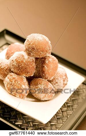 Close-up of a tray of a baked sugar coated dessert View Large Photo Image Stock Image - Close-up of a tray of a baked sugar coated dessert. Fotosearch