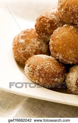 Close-up of a tray of a baked sugar coated dessert View Large Photo Image Stock Image - Close-up of a tray of a baked sugar coated dessert. Fotosearch