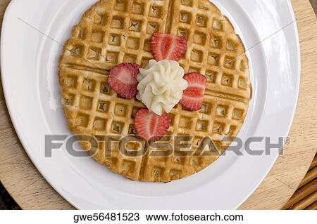 Close-up of a waffle on a plate View Large Photo Image Stock Image - Close-up of a waffle on a plate. Fotosearch