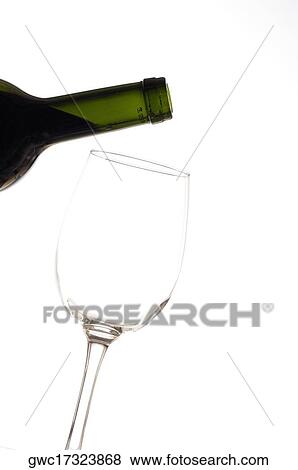 Stock Photo - Close-up of a wineglass and a wine bottle. Fotosearch