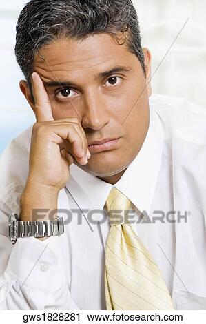 Close-up of a worried businessman View Large Photo Image Stock Image - Close-up of a worried businessman. Fotosearch