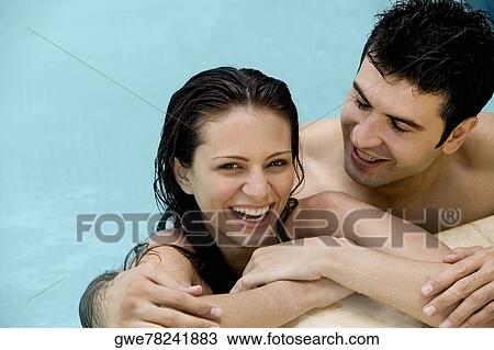 Close-up of a young couple in a swimming pool View Large Photo Image Stock Image - Close-up of a young couple in a swimming pool. Fotosearch