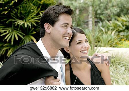 Close-up of a young couple smiling View Large Photo Image Stock Image - Close-up of a young couple smiling. Fotosearch