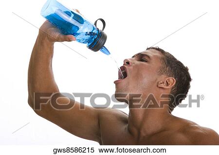 Close-up of a young man drinking water from a bottle View Large Photo Image Stock Photography - Close-up of a young man drinking water from a bottle. Fotosearch