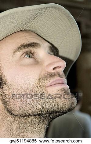 Close-up of a young man looking up, New York City, New York State, USA View Large Photo Image Stock Photography - Close-up of a young man looking up, New York City, New York State, USA. Fotosearch