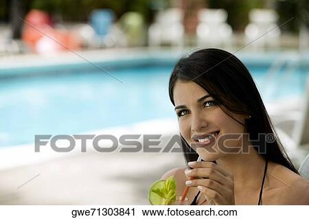 Stock Image - Close-up of a young woman smiling. Fotosearch