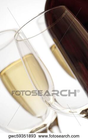Close-up of champagne flutes and wine glass with a wine bottle View Large Photo Image Stock Image - Close-up of champagne flutes and wine glass with a wine bottle. Fotosearch