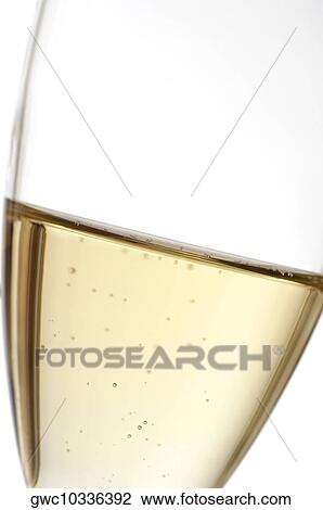 Close-up of champagne in a champagne flute View Large Photo Image Stock Image - Close-up of champagne in a champagne flute. Fotosearch