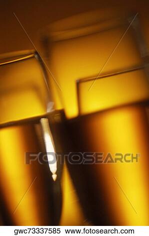 Close-up of champagne in champagne flutes View Large Photo Image Stock Photography - Close-up of champagne in champagne flutes. Fotosearch