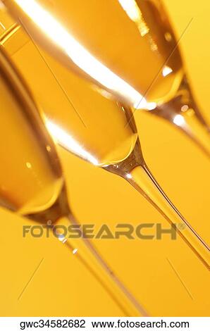 Close-up of champagne in three champagne flutes View Large Photo Image Stock Image - Close-up of champagne in three champagne flutes. Fotosearch