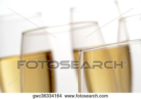 Close-up of champagne in two champagne flutes View Large Photo Image Picture - Close-up of champagne in two champagne flutes. Fotosearch