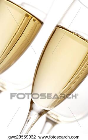 Close-up of champagne in two champagne flutes View Large Photo Image Stock Image - Close-up of champagne in two champagne flutes. Fotosearch
