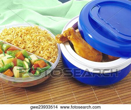 Close-up of cooked chicken legs sticking out of a dish View Large Photo Image Picture - Close-up of cooked chicken legs sticking out of a dish. Fotosearch