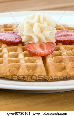 Stock Image - Close-up of cookies in a plate. Fotosearch