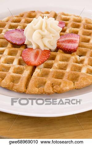 Stock Image - Close-up of cookies in a plate. Fotosearch