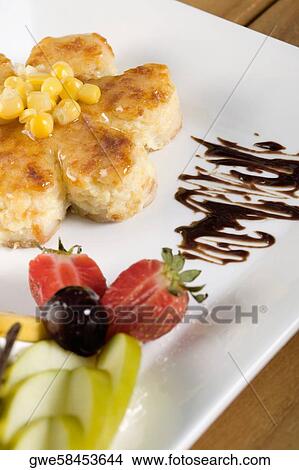 Close-up of corn cakes and fruits in a plate View Large Photo Image Picture - Close-up of corn cakes and fruits in a plate. Fotosearch