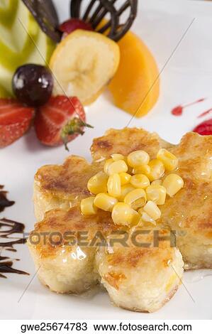 Close-up of corn cakes and fruits in a plate View Large Photo Image Stock Image - Close-up of corn cakes and fruits in a plate. Fotosearch