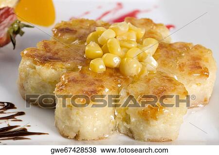 Close-up of corn cakes in a plate View Large Photo Image Stock Photo - Close-up of corn cakes in a plate. Fotosearch